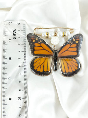 Broche de mariposa monarca