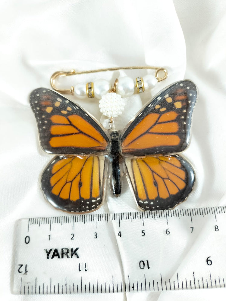 Broche de mariposa monarca