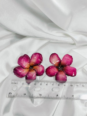 Aretes de flor de mayo rojas