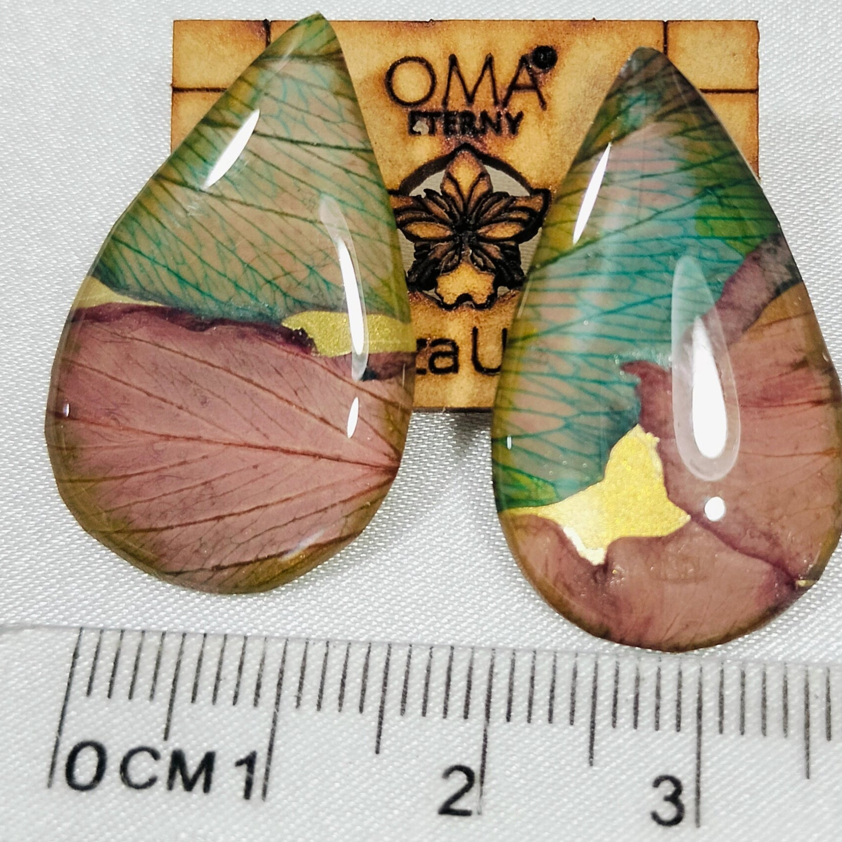 Aretes de orquídea en gota