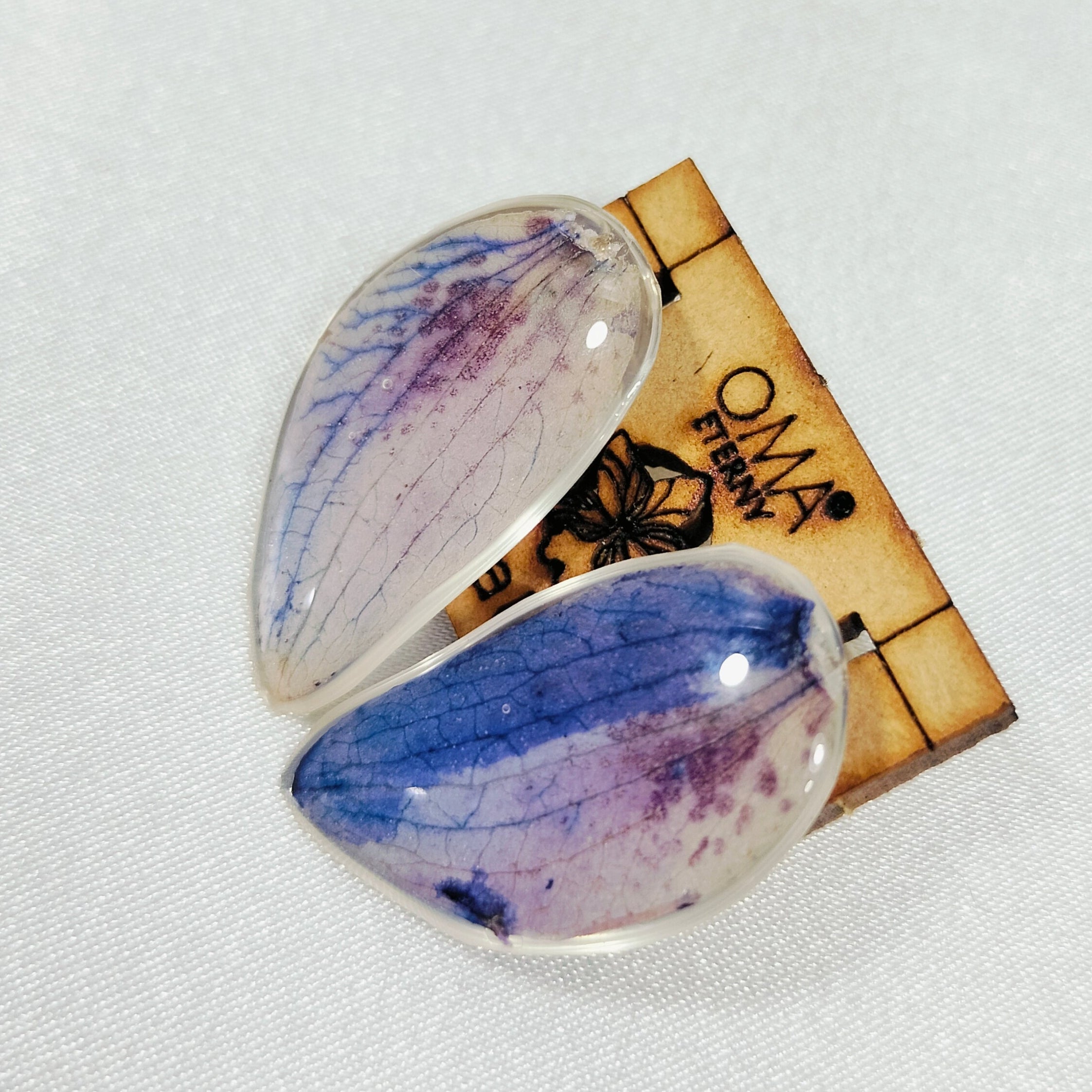 Aretes de orquídea en gota tonalidades azules