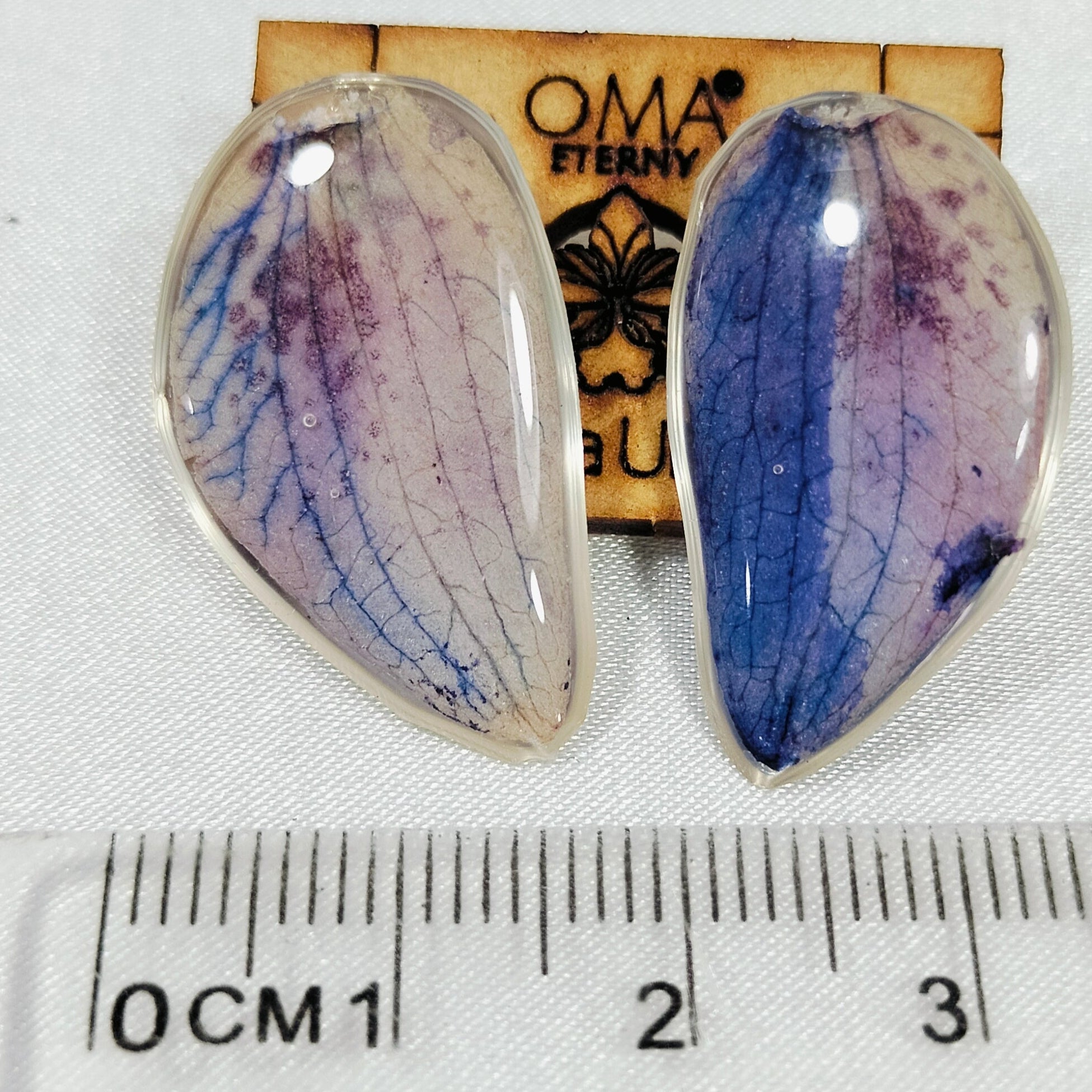 Aretes de orquídea en gota tonalidades azules
