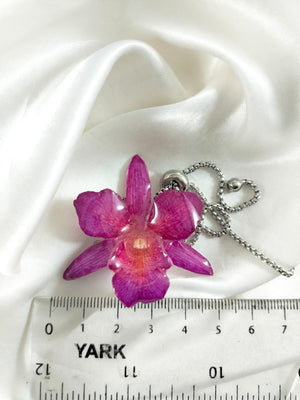 Pulsera de orquídea guinda