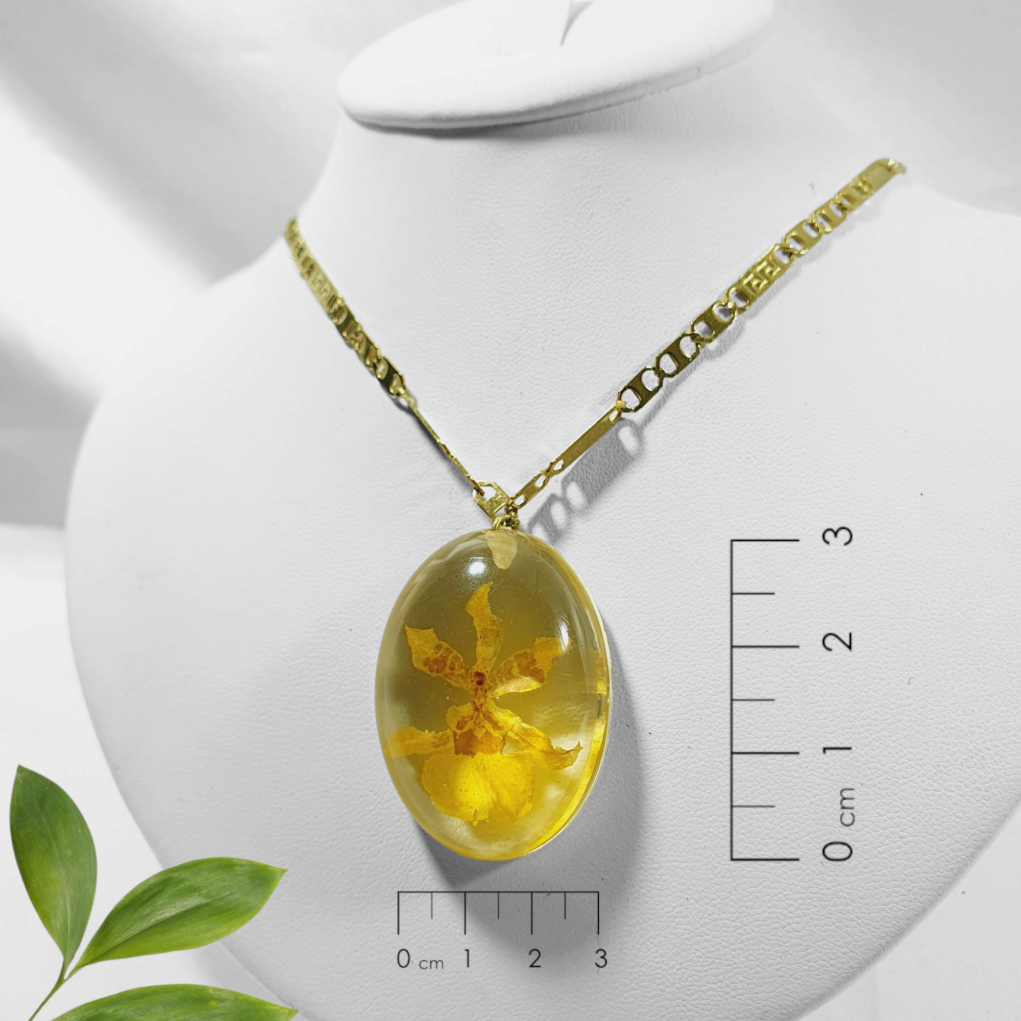 dije de orquidea en burbuja